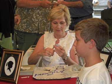 The Artist Cutting a Silhouette of a Young Boy