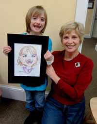 Artist with Young Caricature Subject